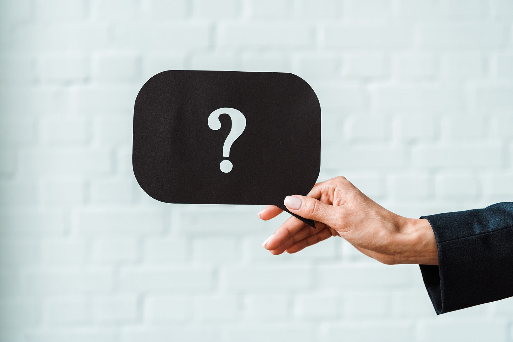 Käsi ja kysymysmerkki